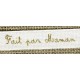 White ribbon printed gold lettering: Made by Mom