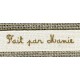 Beige ribbon printed brown lettering: Made by Grandma