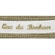 White ribbon printed gold lettering: That of the happiness