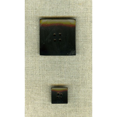 Curved square button in black horn.
