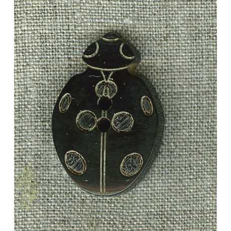 Ladybird button in black horn.